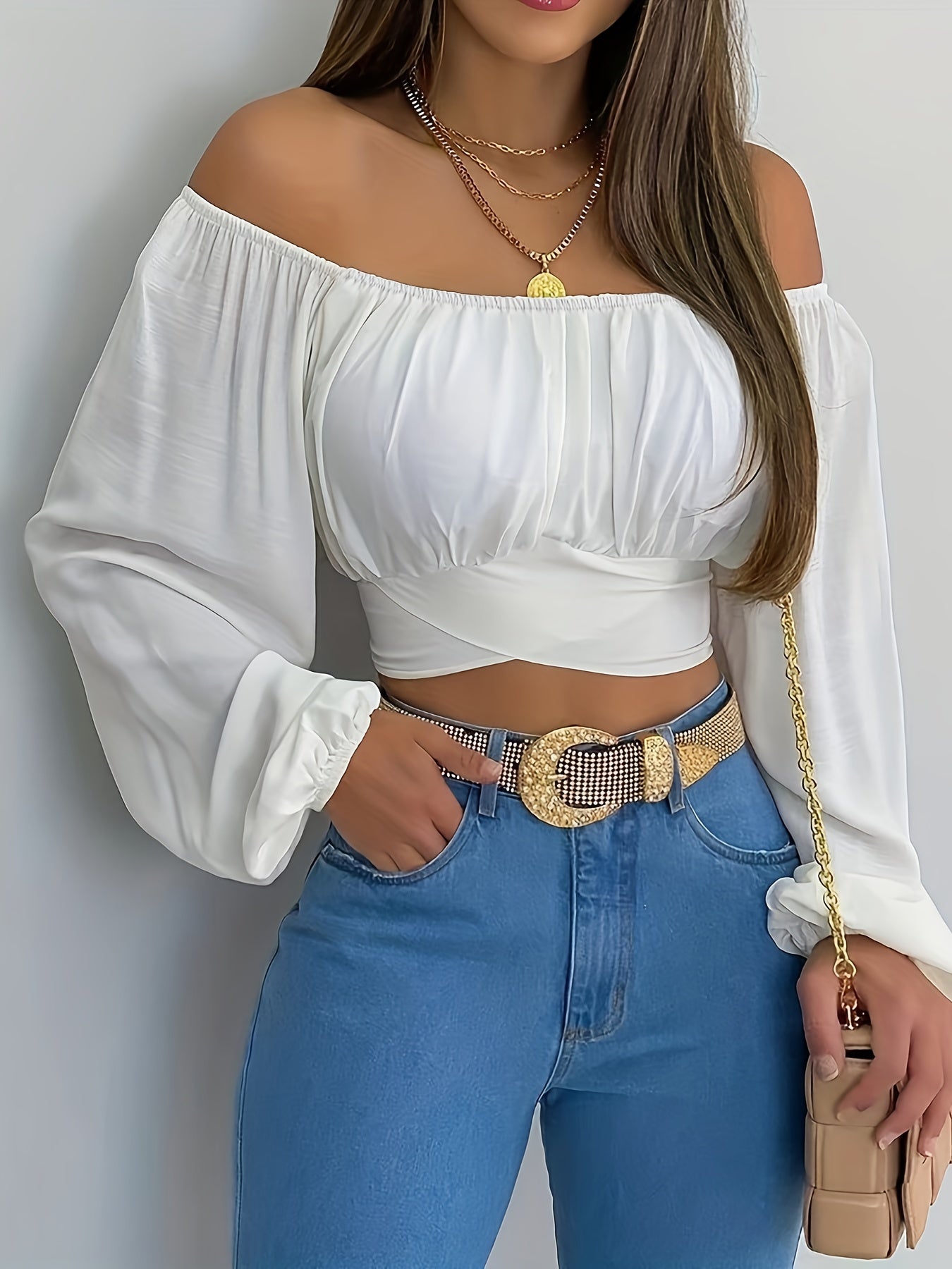Blusa corta lisa con lazo en la espalda