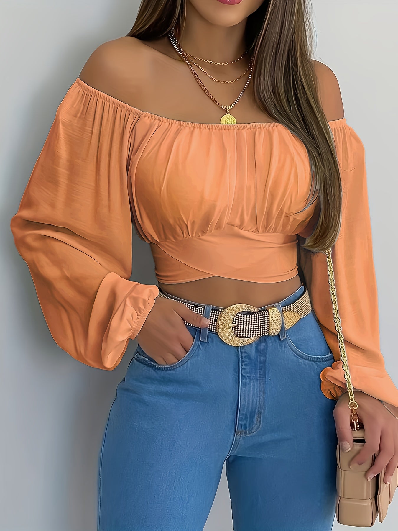 Blusa corta lisa con lazo en la espalda